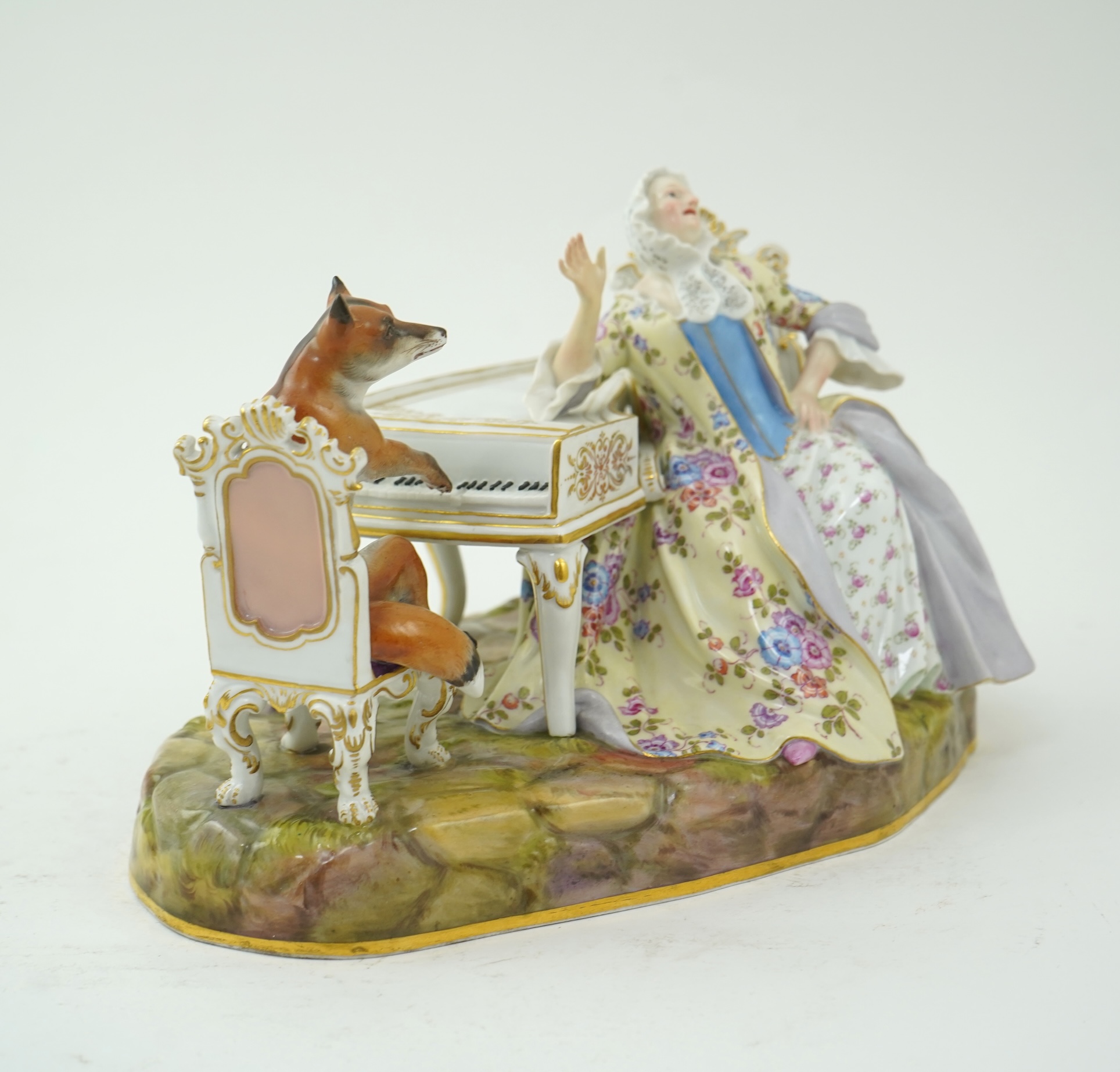 A Meissen group of a fox at the piano and a lady listening, after J. J. Kandler, late 19th century